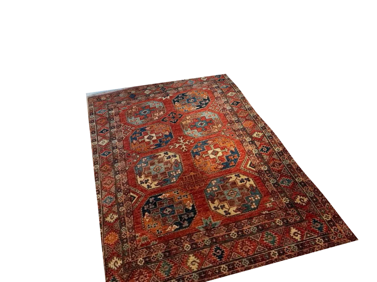 Tapis d'Orient noué main à motifs géométriques rouges, présenté à plat